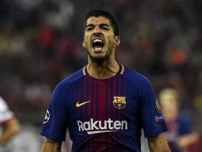 ﻿FILED - 01 November 2017, Greece, Athens: Barcelona's Luis Suarez reacts during the UEFA Champions League Group D soccer match between Olympiacos and FC Barcelona at the Karaiskaki stadium in Piraeus. Italian police are investigating possible irregularities in the Italian language exam taken by Uruguayan striker Luis Suarez at the University for Foreigners in Perugia in order to obtain an Italian passport. Photo: Angelos Tzortzinis/dpa