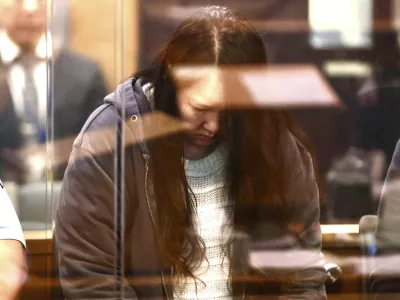 Hakyung Lee stands in the dock at the High Court in Auckland, New Zealand, Monday, Sept. 8, 2025. (Lawrence Smith/Stuff Pool Photo via AP)
