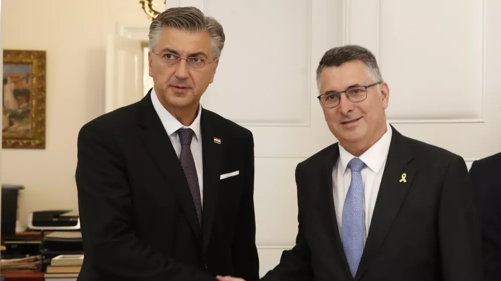 Israels's Foreign Minister Gideon Saar, right, is welcomed by Croatian Prime minister Andrej Plenkovic in Zagreb, Croatia, Tuesday, Sept. 9, 2025. (AP Photo)