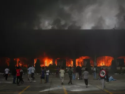 A fire burns inside the Parliament complex during a protest against Monday's killing of 19 people after anti-corruption protests that were triggered by a social media ban, which was later lifted, during a curfew in Kathmandu, Nepal, September 9, 2025. REUTERS/Adnan Abidi