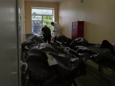 Bodies of civilians killed in a Russian aerial attack on village of Yarova, are seen at a morgue in Donetsk region, Tuesday, Sept. 9, 2025. (AP Photo/Alex Babenko)