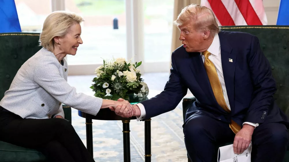 FILE PHOTO: U.S. President Donald Trump shakes hands with European Commission President Ursula von der Leyen, after an announcement of a trade deal between the U.S. and EU, in Turnberry, Scotland, Britain, July 27, 2025. REUTERS/Evelyn Hockstein/File Photo