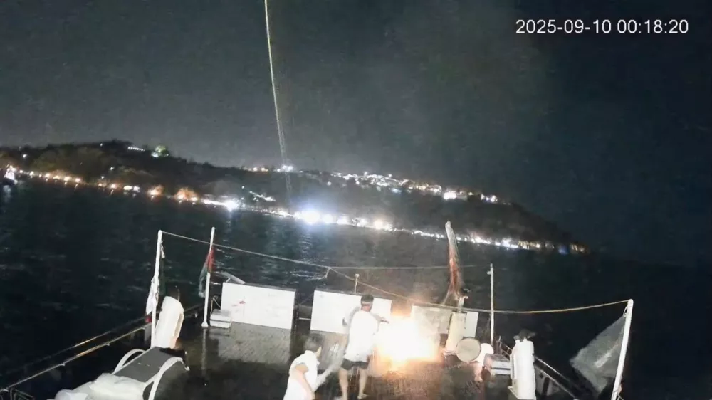 A CCTV footage shows men on board dousing a fire that struck Alma, a vessel of the Global Sumud Flotilla (GSF), in the Tunisian waters off the coast of Tunisia, September 9, 2025, in this screengrab obtained from a handout video.  GLOBAL SUMUD FLOTILLA/Handout via REUTERS  THIS IMAGE HAS BEEN SUPPLIED BY A THIRD PARTY. NO RESALES. NO ARCHIVES. MANDATORY CREDIT. VERIFICATION - Reuters was able to confirm the vessel from characteristics of ship exterior that matched file images. - Reuters was able to locate the footage from ship tracking websites and topography of the landscape and the shape and position of the road matched satellite imagery of the area. - Reuters was able to confirm the date of footage with Global Sumud Flotilla spokesperson, Wael Nawar. - Nawar also told Reuters that the timestamp difference shown on footage was likely due to camera being installed in Spain, which was an hour ahead of Tunisia.