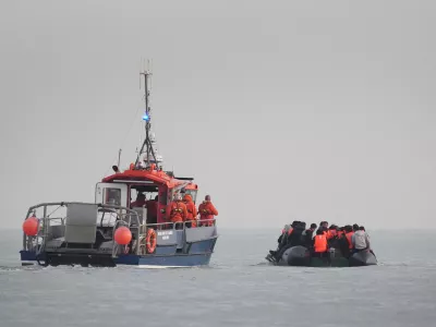 31 May 2025, France, Gravelines: French authorities escort people thought to be migrants onboard a small boat leaving the beach at Gravelines, France, in an attempt to reach the UK by crossing the English Channel. Photo: Gareth Fuller/PA Wire/dpa