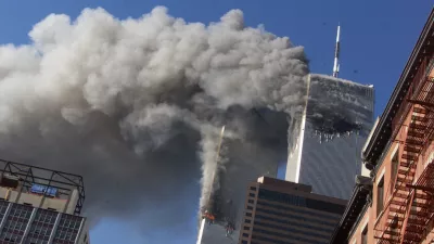 FILE - In this Sept. 11, 2001, file photo, smoke rises from the burning twin towers of the World Trade Center after hijacked planes crashed into the towers in New York City. Sept. 11 victimsâ€™ relatives are greeting the news of President Donald Trumpâ€™s now-canceled plan for secret talks with Afghanistanâ€™s Taliban insurgents with mixed feelings. (AP Photo/Richard Drew, File)