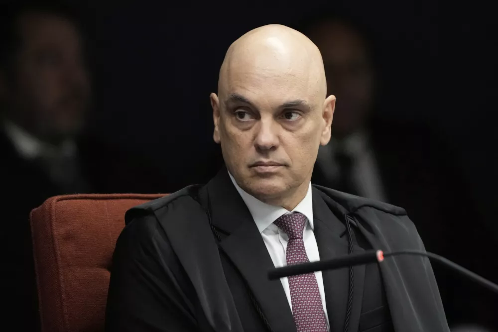 Supreme Court Justice Alexandre de Moraes attends the verdict and sentencing phase of a trial for those charged in an alleged coup plot to keep Brazil's former President Jair Bolsonaro in office after his 2022 election defeat, in Brasilia, Brazil, Thursday, Sept. 11, 2025. (AP Photo/Eraldo Peres)