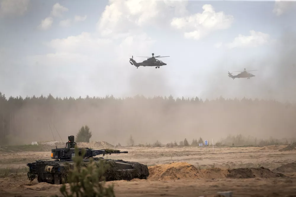FILE - Eurocopters Tiger of the German Army take part in the Lithuanian-German division-level international military exercise 'Grand Quadriga 2024' at a training range in Pabrade, north of the capital Vilnius, Lithuania on May 29, 2024. (AP Photo/Mindaugas Kulbis, File)