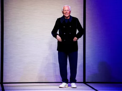FILE PHOTO: Designer Giorgio Armani appears at the end of the Giorgio Armani Fall-Winter 2025/2026 menswear collection during Milan Fashion Week, in Milan, Italy, January 20, 2025. REUTERS/Alessandro Garofalo/File Photo