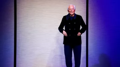 FILE PHOTO: Designer Giorgio Armani appears at the end of the Giorgio Armani Fall-Winter 2025/2026 menswear collection during Milan Fashion Week, in Milan, Italy, January 20, 2025. REUTERS/Alessandro Garofalo/File Photo