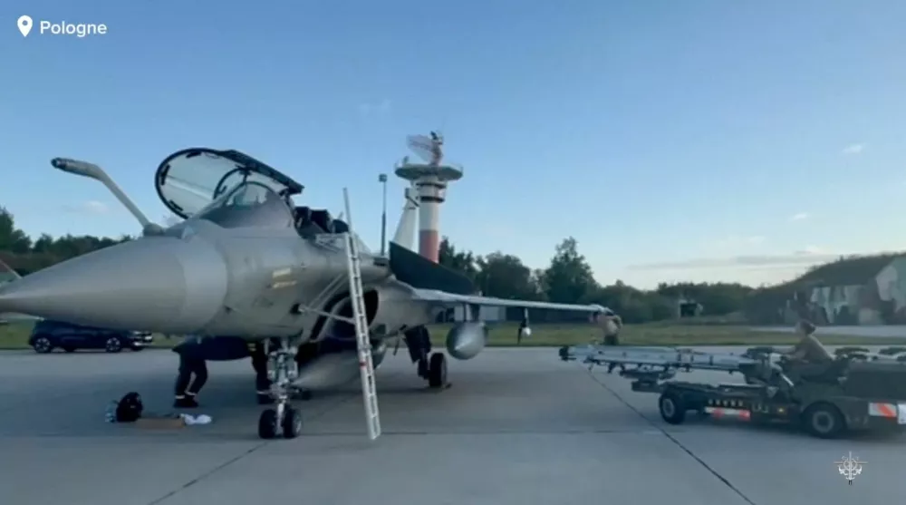 A person works at a French Rafale aircraft, one of 3 mobilised by France following the launch of the Eastern Sentry operation to bolster the defence of NATO's eastern flank in response to Russian drone incursions into Polish airspace, in a location given as Poland in this screen grab from a handout video released on September 12, 2025. French Armed Forces/Handout via REUTERS THIS IMAGE HAS BEEN SUPPLIED BY A THIRD PARTY. NO RESALES. NO ARCHIVES. MANDATORY CREDIT
