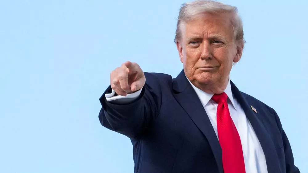 FILE PHOTO: U.S. President Donald Trump gestures, while he boards Air Force One, as he departs for New York at Joint Base Andrews, Maryland, U.S., September 11, 2025. REUTERS/Ken Cedeno/File Photo