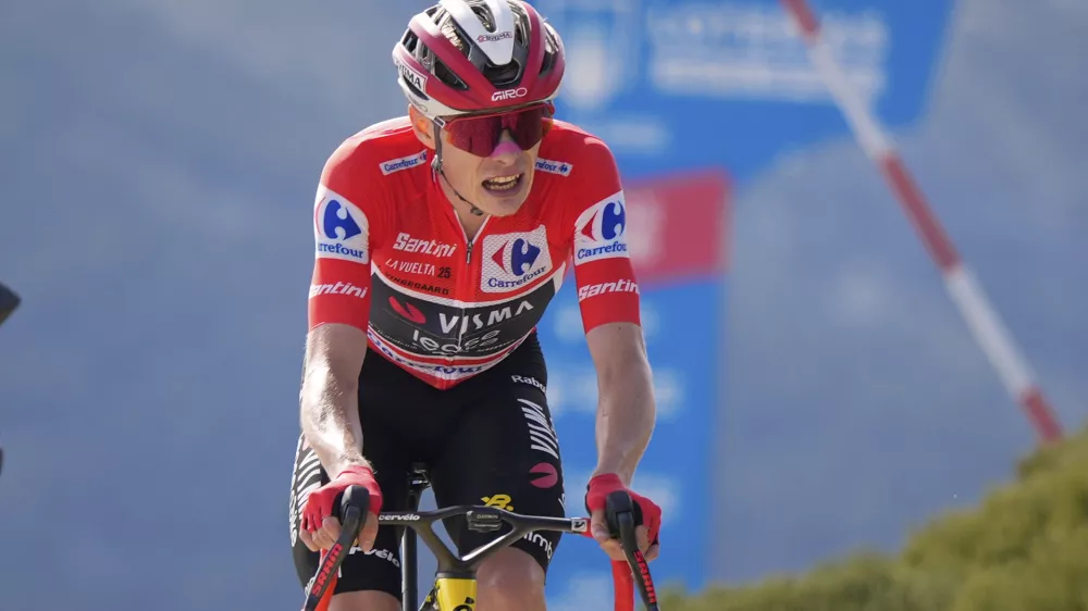 Danish cyclist Jonas Vingegaard completes the final meters before winning the 20th stage and his first overall victory in the Spanish cycling race La Vuelta, from Robledo de Chavela to Bola del Mundo, in Puerto de Navacerrada, Spain, on Saturday, September 13, 2025. (AP Photo/Manu Fernández)