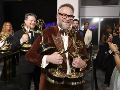 IMAGE DISTRIBUTED FOR THE TELEVISION ACADEMY – EXCLUSIVE - Seth Rogen picks up their official Emmy statuette at the 77th Emmy Awards Trophy Table on Sunday, Sept. 14, 2025 at the Peacock Theater in Los Angeles. (Photo by Mark Von Holden/Invision for the Television Academy/AP Content Services)