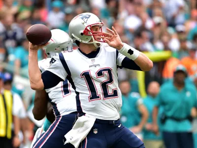 ﻿Dec 9, 2018; Miami Gardens, FL, USA; New England Patriots quarterback Tom Brady (12) throws a pass against the Miami Dolphins during the first half at Hard Rock Stadium. Mandatory Credit: Steve Mitchell-USA TODAY Sports
