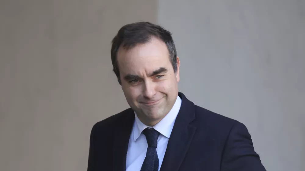 FILE - French Defense Minister Sebastien Lecornu leaves the first cabinet meeting of the new government, at the Elysee Palace in Paris, Friday, Jan. 3, 2025. (AP Photo/Thomas Padilla, File)