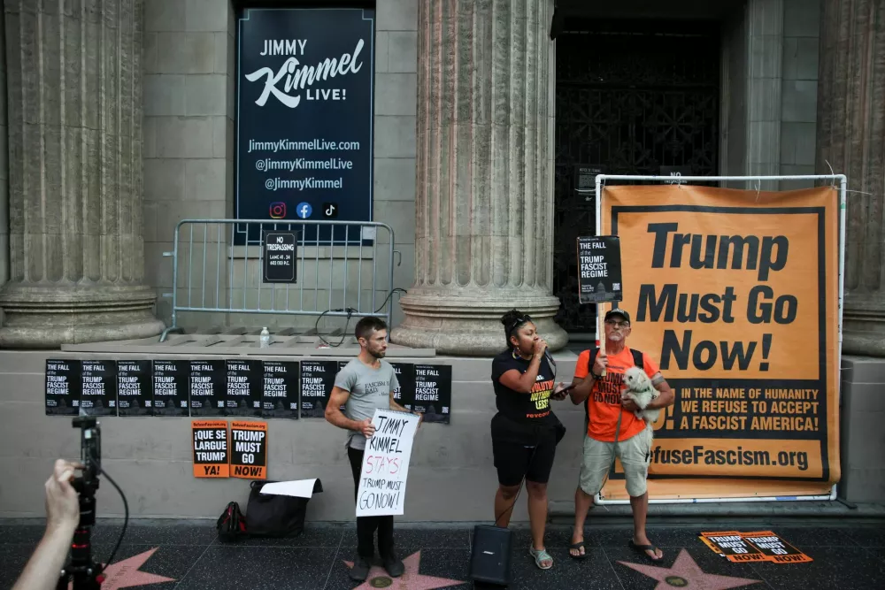 People demonstrate outside the El Capitan Entertainment Centre, where "Jimmy Kimmel Live!" is recorded for broadcast, on Hollywood Boulevard in Los Angeles, California, U.S. September 17, 2025. REUTERS/Daniel Cole