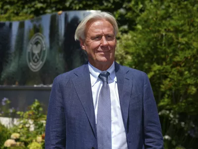 FILE - Tennis great Bjorn Borg poses for a photo as he arrives for Day 11 at the Wimbledon Tennis Championships in London, July 10, 2025. (AP Photo/Joanna Chan, File)