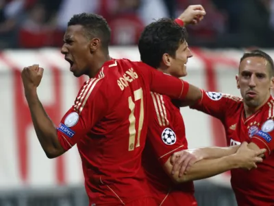 ﻿Bayern Munich's Mario Gomez celebrates with his team mates Franck Ribery (R) and Jerome Boateng (L) after scoring a goal against Barcelona during the Champions League semi-final first leg soccer match at Arena stadium in Munich April 23, 2013.         REUTERS/Michaela Rehle (GERMANY - Tags: SPORT SOCCER)