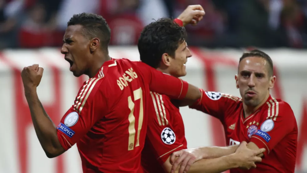 ﻿Bayern Munich's Mario Gomez celebrates with his team mates Franck Ribery (R) and Jerome Boateng (L) after scoring a goal against Barcelona during the Champions League semi-final first leg soccer match at Arena stadium in Munich April 23, 2013.         REUTERS/Michaela Rehle (GERMANY - Tags: SPORT SOCCER)