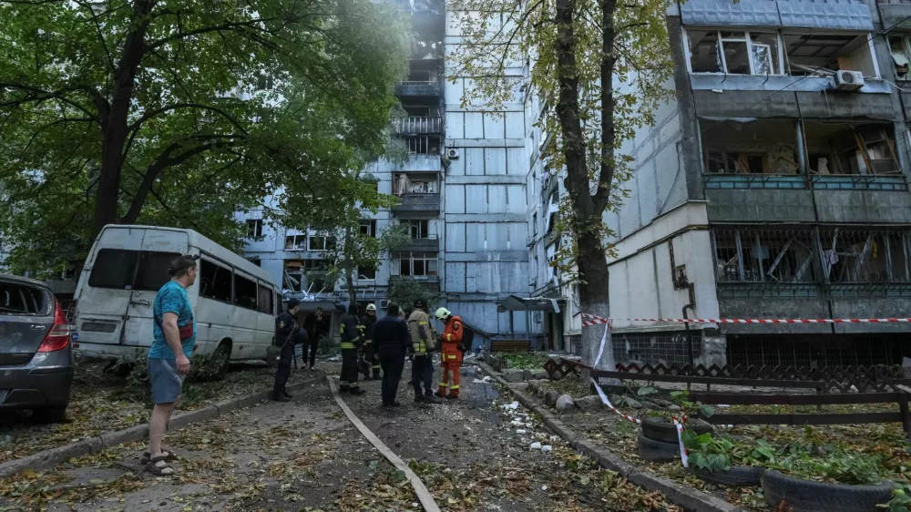 Firefighters work at the site of apartment buildings hit during a Russian missile strike, amid Russia's attack on Ukraine, in Dnipro, Ukraine September 20, 2025. REUTERS/Mykola Synelnykov