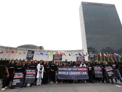 IMAGE DISTRIBUTED FOR DOCTORS WITHOUT BORDERS/MÉDECINS SANS FRONTIÈRES USA (MSF USA) - With the United Nations General Assembly underway, Doctors Without Borders/Médecins Sans Frontières USA (MSF USA) staff, medical aid workers, and supporters gather in front of U.N. Headquarters to call on world leaders to take action and end the genocide in Gaza, Wednesday, Sept. 17, 2025 in New York. (Jason DeCrow/AP Content Services for Doctors Without Borders/Médecins Sans Frontières USA (MSF USA))