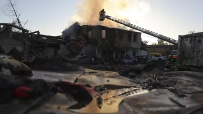 Rescue workers put out a fire at a building destroyed during a Russian strike in Zaporizhzhia, Ukraine, Monday, Sept. 22, 2025. (AP Photo/Kateryna Klochko)