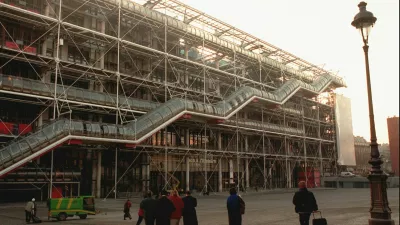 ﻿FILE - People walk in front of the Georges Pompidou Center in Paris on Jan. 28, 1997. Richard Rogers, the lauded British architect who was one of the forces behind the Pompidou Center in Paris and later designed London's Millennium Dome has died. He was 88. Rogers Stirk Harbour + Partners, the company he founded, confirmed his death in a statement Sunday Dec. 19, 2021. (AP Photo/Remy de la Mauviniere, File)