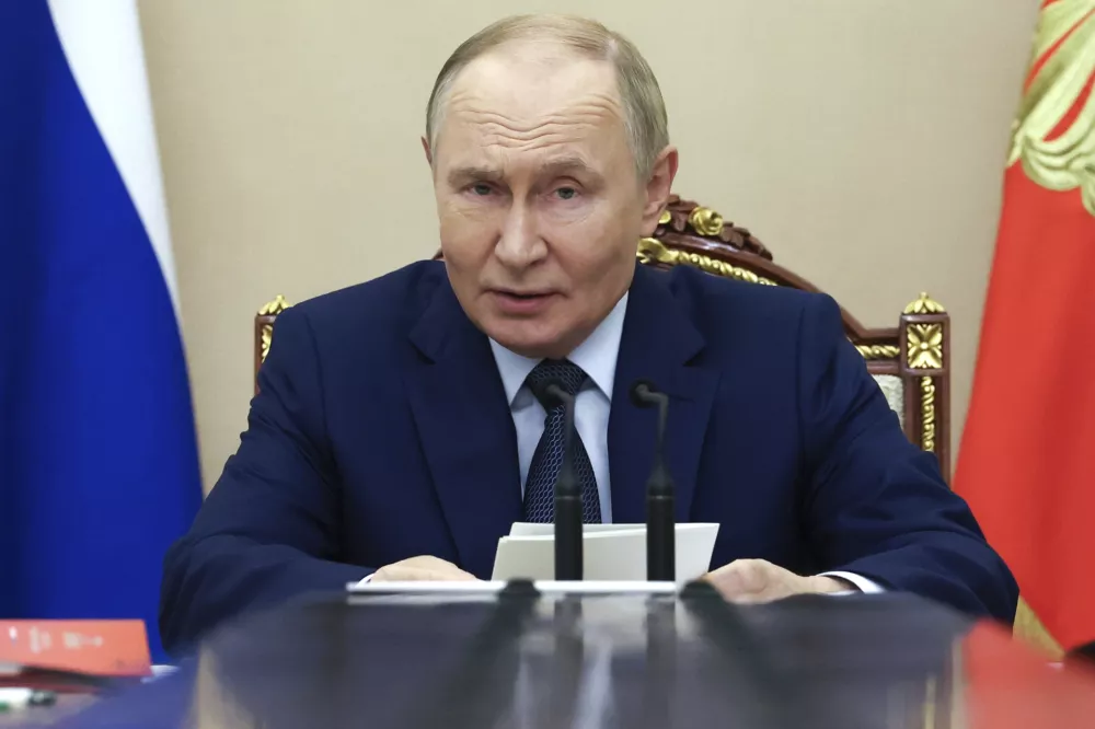 Russian President Vladimir Putin chairs a Security Council meeting at the Kremlin in Moscow, Russia, Monday, Sept. 22, 2025. (Alexander Kazakov, Sputnik, Kremlin Pool Photo via AP)