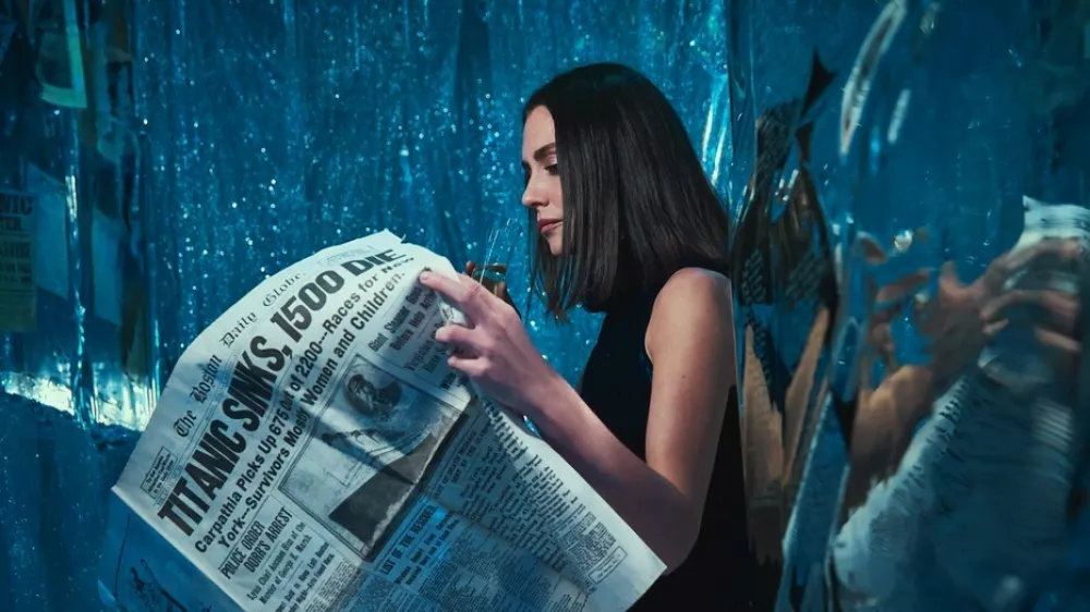 Story from Jam Press (Titanic Decorated Apartment)Pictured: Sarah Boll.Woman who has seen Titanic hundreds of times turns FLAT into ship replica with iceberg – and invites HINGE date overA woman has turned her flat into the TITANIC complete with a grand staircase and an iceberg – and she even invited her Hinge date round for a tour.Superfan Sarah Boll has spent months transforming her two-bed rental into a full-blown tribute to the doomed liner – and she's gone full steam ahead.The 27-year-old says what started as an idea for a small themed party quickly spiralled into an obsession.Now her walls, ceilings and even her bedroom have been revamped to recreate the ship's most famous rooms.From portholes to a "sinking room" and replica artefacts, every room has been styled to make you feel like you're stepping back into 1912."I've been a huge Titanic fanatic, to say the least, since I was 11," the model and a real estate agent told What's The Jam."For my high school graduation, my dad gave me a model ship of the Titanic, and my mom shipped it to me when I had space for it."I was going to have a small Titanic party, but once I started decorating, it was difficult to stop – especially after I started posting videos on TikTok.'Also, I just love interior design and anything to do with shades of blue and water."Sarah started decorating her New York City apartment in March 2025.Step inside and you're greeted by her version of the Grand Staircase, built with stick-on tiles, plastic ceiling panels and even a salad bowl turned into the glass dome.There are velvet ribbon walls, gold trim, faux greenery and mirrors dressed up as café windows.Sarah says her friends and family have been stunned by the transformation – but none more so than her Hinge date, who got the full Titanic tour when he came over to visit.She said: "He was totally on board. I told him about my apartment before he came over and asked if he would be okay if I filmed his reaction. He was so chill about it."The reactions from everyone else have been hilarious. Some people like it and others think it's insane."It's been 50/50 – there's been a lot of, 'I can't decide if she's cool or needs to be institutionalised'"Sarah says the real showstopper is her "sinking room", where visitors can first see Titanic sailing on a starry night before it hits the iceberg.Walking into the room, a model ship dangles from the ceiling mid-sink while a dresser painted to look like the liner appears to go down beneath the waves.The floor shimmers with mirrored silver paper like water, fabric drapes create the feel of being underwater and mini replicas show the wreck on the seabed.Sarah has even filled drawers with sand and crockery to echo what divers found.The bathroom continues the theme, covered in mirrored paper and newspaper clippings, with all 1,500 victims' names written out and stuck on the walls.Meanwhile, her bedroom has been styled as a first-class suite, complete with a gold comforter and a porthole by the bed.Sarah admits the whole thing came together impulsively – with no real plan – and she hasn't even kept track of how much it cost.She's since built a following of 18,000 online by sharing TikTok tours of her ship-shaped flat, with viewers torn between calling her a genius or saying she's lost the plot.And while Sarah says she may eventually change her apartment theme, for now she's staying firmly on board the Titanic – enjoying what she calls the best summer of her life.She said: "I'll switch up the theme eventually; I'm planning on an Alice in Wonderland theme."I'm not sure when I'll do that though. I want my parents to see Titanic first."I love my apartment – I've never had a better summer in my life."ENDSEDITOR'S NOTE: Video Usage Licence: (EXCLUSIVE) We have obtained an exclusive licence from the copyright holder. A copy of the licence is available on request.Video Restrictions: None.,Image: 1035233012, License: Rights-managed, Restrictions: EDITOR'S NOTE: Video Usage Licence: (EXCLUSIVE) We have obtained an exclusive licence from the copyright holder. A copy of the licence is available on request.Video Restrictions: None., Model Release: no