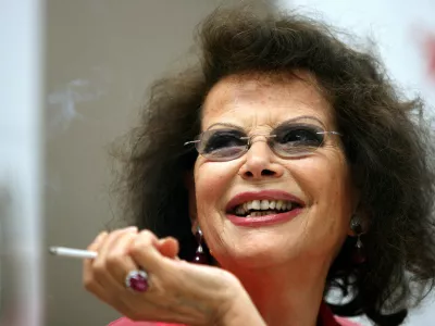 FILE PHOTO: Italian actress Claudia Cardinale smiles during a news conference in Cluj Napoca June 7, 2009. Cardinale received a lifetime award at the end of the eighth edition of the Transylvania International Film Festival (TIFF). REUTERS/Mircea Rosca (ROMANIA ENTERTAINMENT HEADSHOT)/File Photo