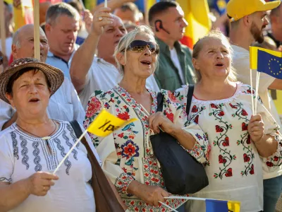 FILE PHOTO: People attend a rally launching the election campaign of the pro-European?Party?of Action and Solidarity (PAS) ahead of the parliamentary elections, in Chisinau, Moldova August 29, 2025. REUTERS/Vladislav Culiomza/File Photo