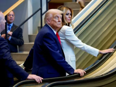 U.S. President Donald Trump and first lady Melania Trump ride an escalator as they arrive to attend the 80th United Nations General Assembly, in New York City, New York, U.S., September 23, 2025. REUTERS/Kylie Cooper TPX IMAGES OF THE DAY