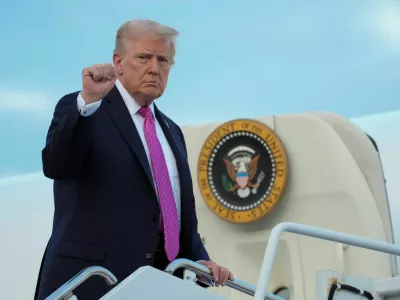 FILE PHOTO: U.S. President Donald Trump gestures as he boards Air Force One to depart for Washington, at Morristown Municipal Airport in Morristown, New Jersey, U.S., September 14, 2025. REUTERS/Ken Cedeno/File Photo