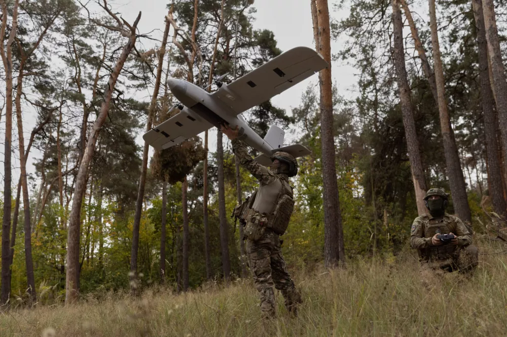 Ukrainian soldiers prepare to launch an Avenger UAV drone in Ukraine's Kharkiv region, Wednesday, Sept. 24, 2025. (AP Photo/Yevhen Titov)