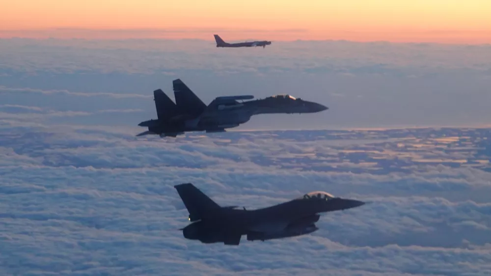 In this image released by the Department of Defense, a North American Aerospace Defense Command F-16 Fighting Falcon fighter aircraft, foreground, escorts a Russian Su-35 fighter, center, and Tu-95 Bear bomber through the Alaskan Air Defense Identification Zone over the Bering Sea Sept. 24, 2025.(U.S. Department of Defense photo)