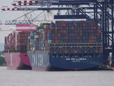 Cargo ships are docked at Port Liberty Terminals, Wednesday, Aug. 6, 2025, in New York. (AP Photo/Frank Franklin II)