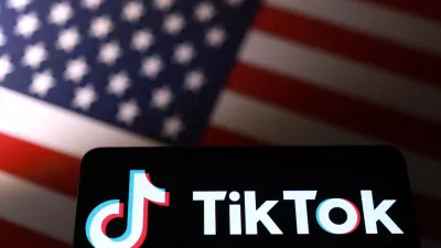 TikTok logo is placed on a U.S. flag in this illustration taken September 24, 2025. REUTERS/Dado Ruvic/Illustration