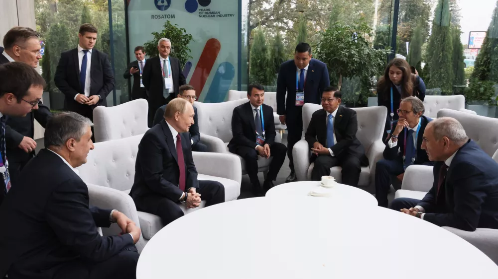 From left; Iranian Vice President and the head of the Atomic Energy Organization of Iran (AEOI) Mohammad Eslami, Russian President Vladimir Putin, Uzbek Deputy Prime Minister Zhamshid Khodzhayev, Myanmar's Military leader Senior Gen. Min Aung Hlaing, International Atomic Energy Agency (IAEA) Director General Rafael Grossi and Armenian Prime Minister Nikol Pashinyan speak ahead of a session at the World Atomic Week forum at the Exhibition of Achievements of National Economy (VDNKh) in Moscow, Thursday, Sept. 25, 2025. (Mikhail Metzel, Sputnik, Kremlin Pool Photo via AP)