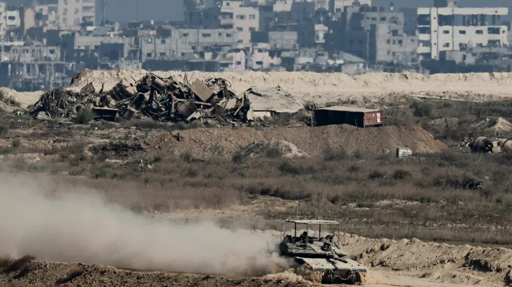 An Israeli tank manoeuvres in Gaza, as seen from the Israeli side of the border, September 28, 2025. REUTERS/Amir Cohen
