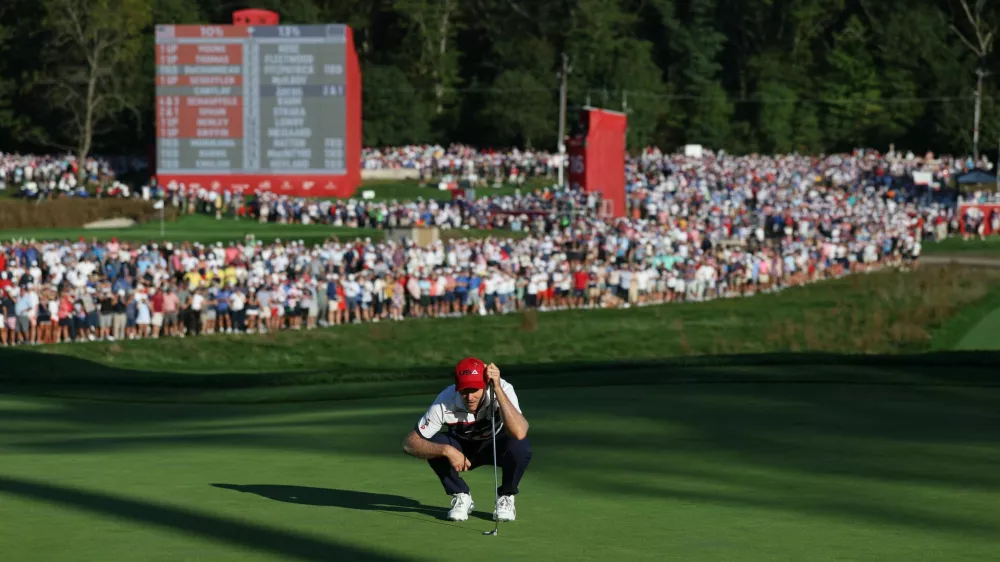 Golf - The 2025 Ryder Cup - Bethpage Black Golf Course, Farmingdale, New York, United States - September 28, 2025 Team USA's Russell Henley lines up his putt on the 17th hole during the singles REUTERS/Paul Childs