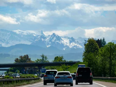 MKHR75 Highway traffic with a mountain range in the background, Switzerland, Europe