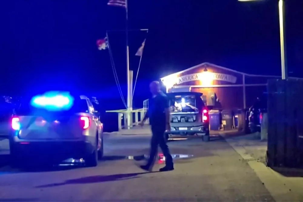 In this photo taken from WWAY-TV video, police work the scene after a shooting in Southport, N.C., Saturday, Sept. 28, 2025. (WWAY-TV via AP)