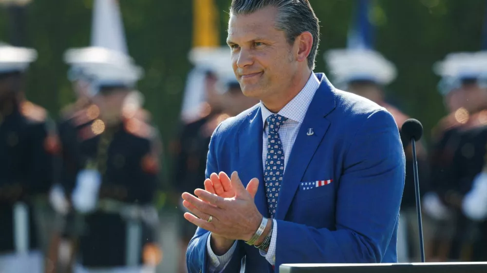 FILE PHOTO: U.S. Defense Secretary Pete Hegseth reacts during a ceremony honoring prisoners of war, at the Pentagon in Washington, D.C. U.S., September 19, 2025. REUTERS/Daniel Becerril/File Photo