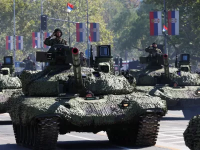 Serbian army soldiers ride on a military vehicles during a military parade in Belgrade, Serbia, September 20, 2025. REUTERS/Zorana Jevtic