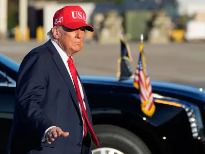 President Donald Trump walks to board Air Force One at Naval Station Norfolk Chambers Field in Norfolk, Va., Sunday, Oct. 5, 2025. (AP Photo/Alex Brandon)
