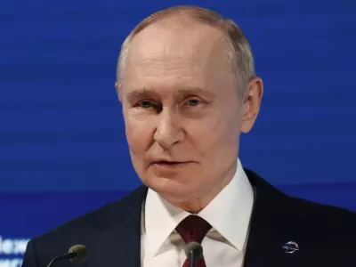 Russian President Vladimir Putin addresses a meeting with foreign policy experts at the Valdai Discussion Club in the Black Sea resort of Sochi, Russia, on Thursday, Oct. 2, 2025. (Mikhail Metzel, Sputnik, Kremlin Pool Photo via AP)