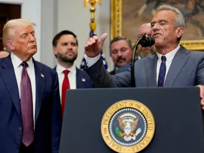 FILE PHOTO: U.S. Health and Human Services Secretary Robert F. Kennedy Jr. gestures as he delivers remarks next to U.S. President Donald Trump in the Roosevelt Room at the White House in Washington, D.C., U.S., July 31, 2025. REUTERS/Kent Nishimura/File Photo
