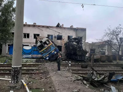 A railway employee stands next to a destroyed train at the compound of a depot after it was hit during an overnight Russian drone strike, amid Russia's attack on Ukraine, in Odesa, Ukraine October 2, 2025. Deputy Prime Minister for Restoration of Ukraine and Minister for Communities and Territories Development of Ukraine Oleksii Kuleba via Facebook/Handout via REUTERS ATTENTION EDITORS - THIS IMAGE HAS BEEN SUPPLIED BY A THIRD PARTY. NO RESALES. NO ARCHIVES.