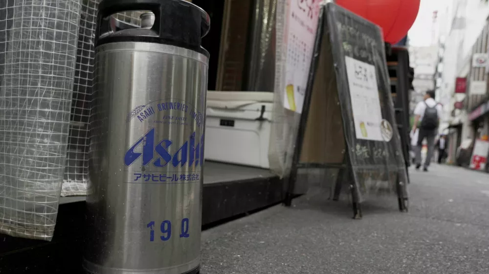 An empty keg of Asahi Super Dry stands outside the restaurant Kushiyaki Tosaka in Tokyo, Japan, October 3, 2025. REUTERS/Joseph Campbell