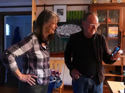 Mary E. Brunkow and her husband Ross Colquhoun talk with one of their daughters on the phone about her winning a Nobel Prize in medicine for part of her work on peripheral immune tolerance, in Seattle, Monday, Oct. 6, 2025. (AP Photo/Lindsey Wasson)